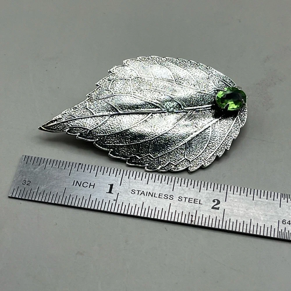 Silver Leaf Brooch with Green Gem